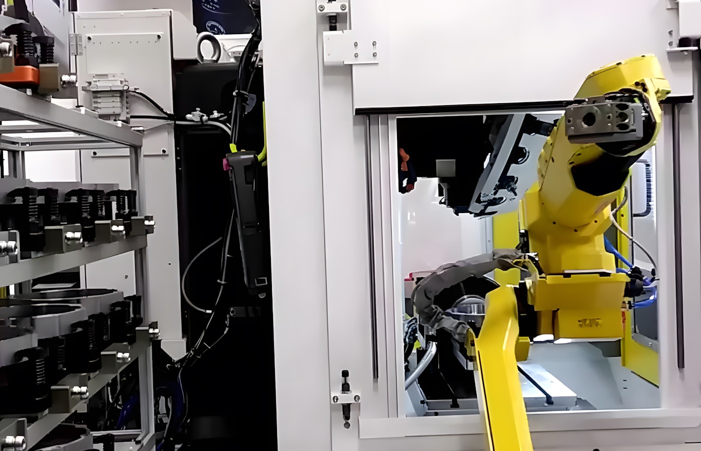 Robot arm in a CNC machine cell